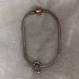 PANDORA rose gold bead charm bracelet with ferris wheel charm.